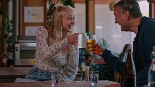 Phil Rosenthal enjoys a beer with his daughter Lily on the Netflix series Sombody Feed Phil